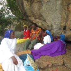 Joshua with nuns and women praying.