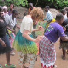 Me dancing with local women.
