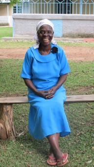 Mama smiling in her blue church prayer group uniform.